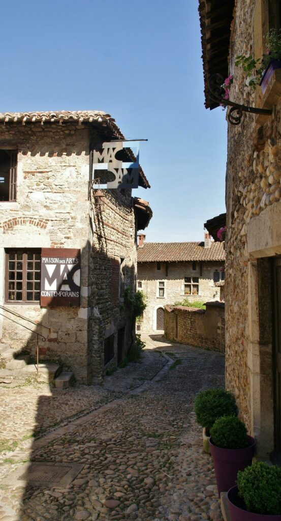 Explore the historic cobblestone streets of Pérouges in France, a beautifully preserved medieval town.